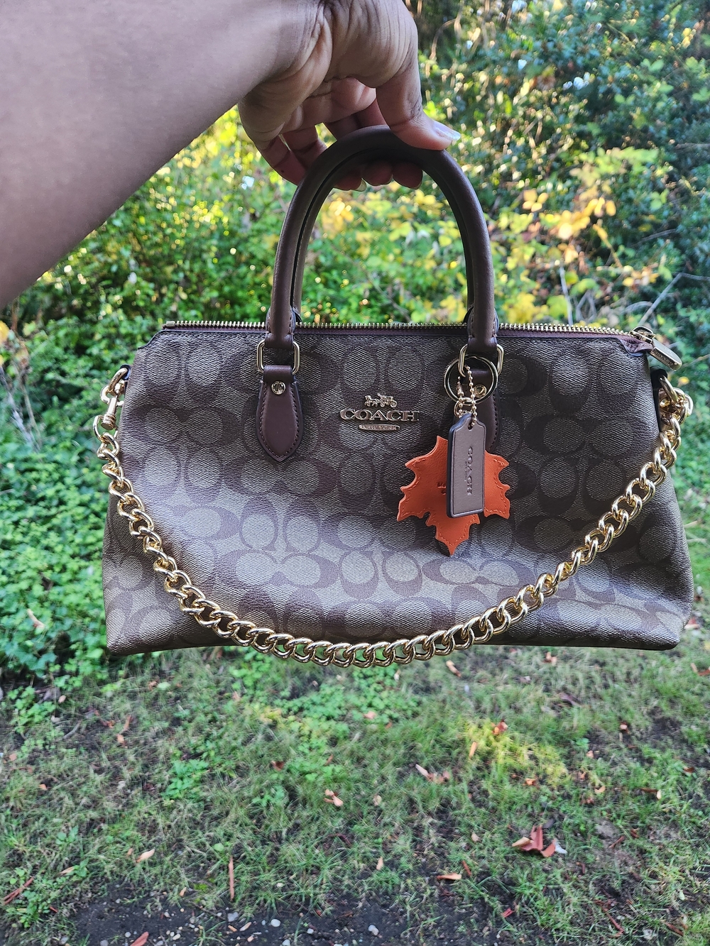 Coach Brown Signature Canvas Satchel with Orange Leaf Charm and Gold Chain